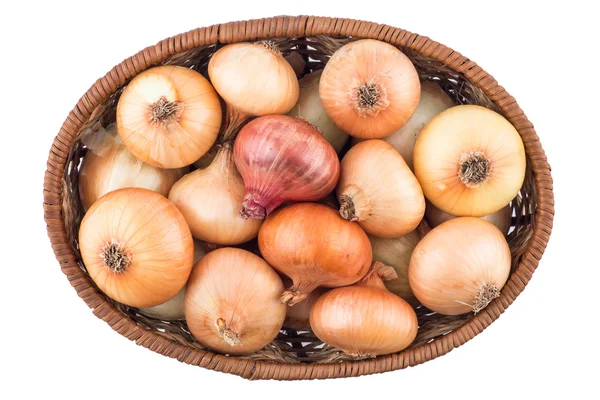 Basket with onion isolated on a white background. — Stock Photo, Image