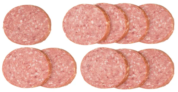 Slices of salami sausages isolated on a white background. — Stock Photo, Image