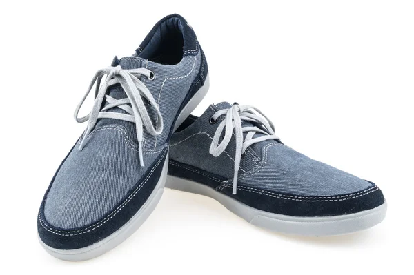 Imagen de un par de zapatillas azules sobre un fondo blanco —  Fotos de Stock
