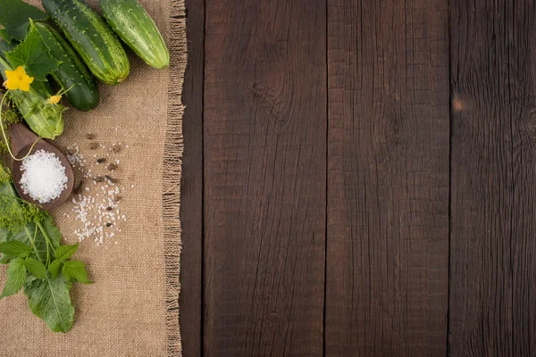 Fresh cucumbers on the old wooden table. — Stock Photo, Image