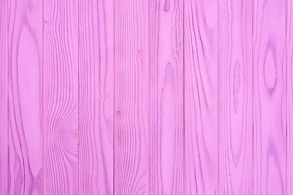 A wall made of purple wood planks. Top view.