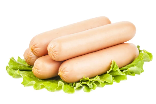 Few sausage on the leaf of lettuce — Stock Photo, Image