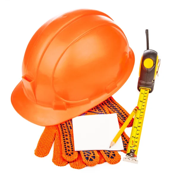 Construction helmet with measure tape and gloves on white backgr — Stock Photo, Image