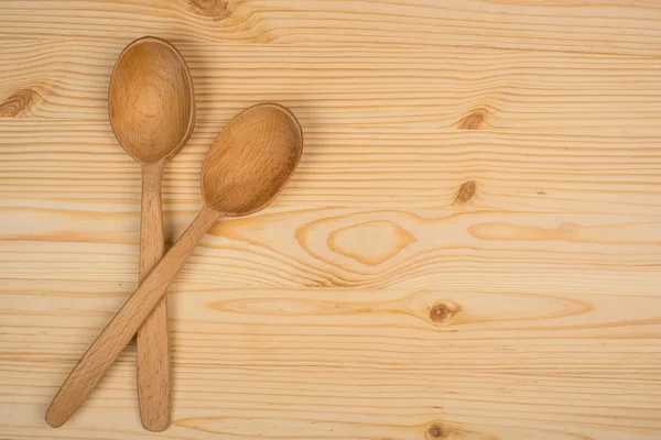 Cucchiaio di legno su sfondo di legno — Foto Stock