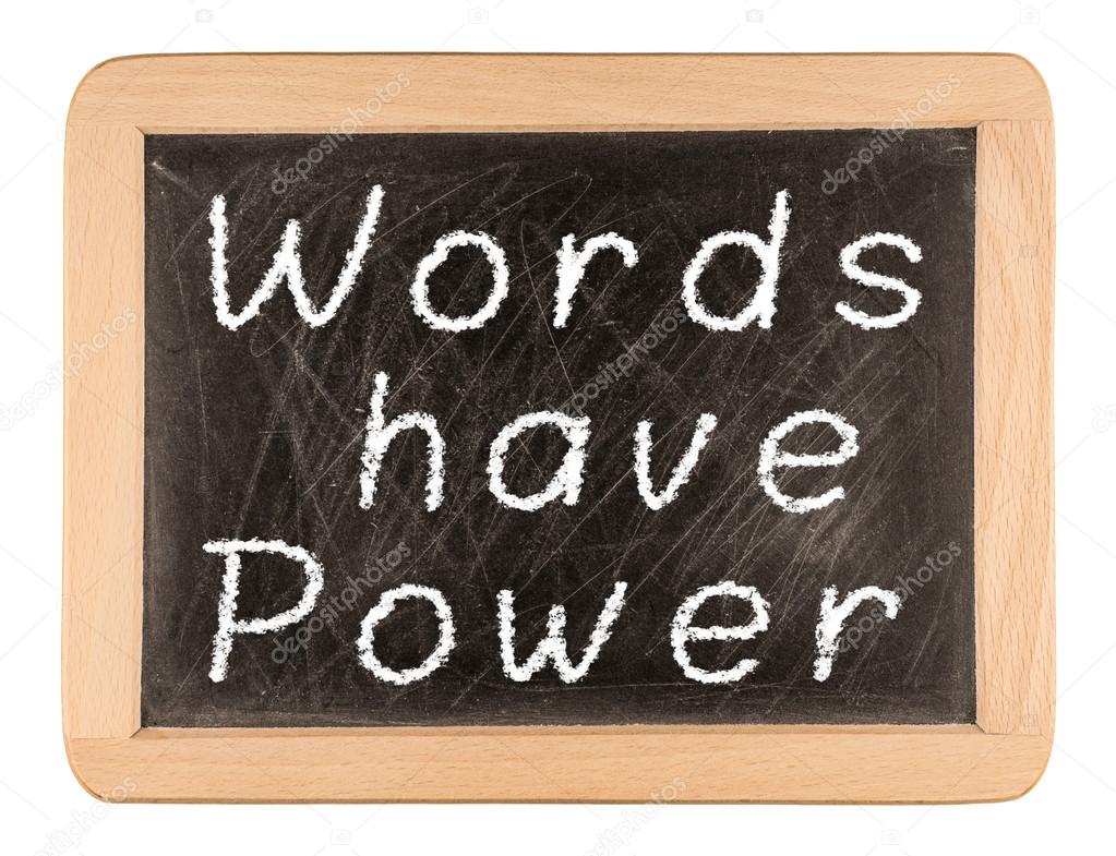 The phrase Words Have Power written in white chalk on a used bla