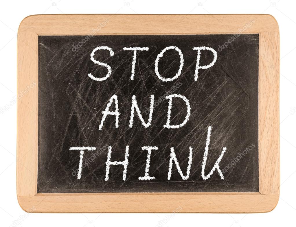 The phrase Stop and Think written on a blackboard as a reminder 