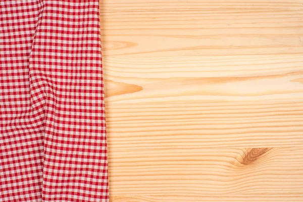 El mantel a cuadros en la mesa de madera — Foto de Stock