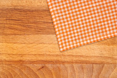 Rustic wooden boards with a orange checkered tablecloth clipart