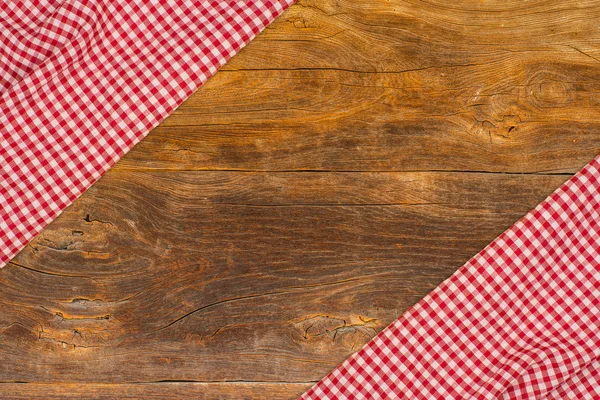 El mantel a cuadros en la mesa de madera — Foto de Stock