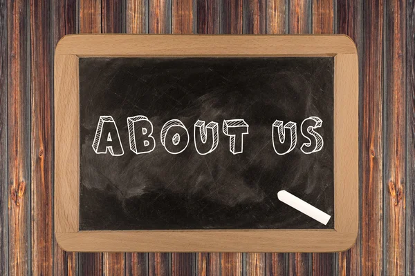 About us - chalkboard with 3D outlined text - on wood — Stock Photo, Image