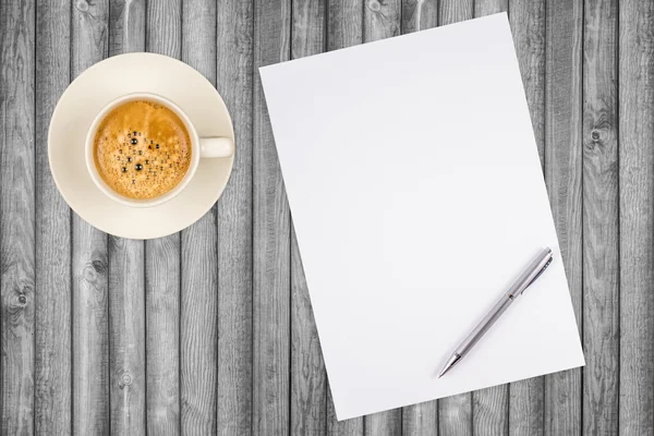 Blank paper with pen and coffee cup on wood table — Stock Photo, Image