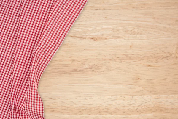 El mantel a cuadros en la mesa de madera — Foto de Stock