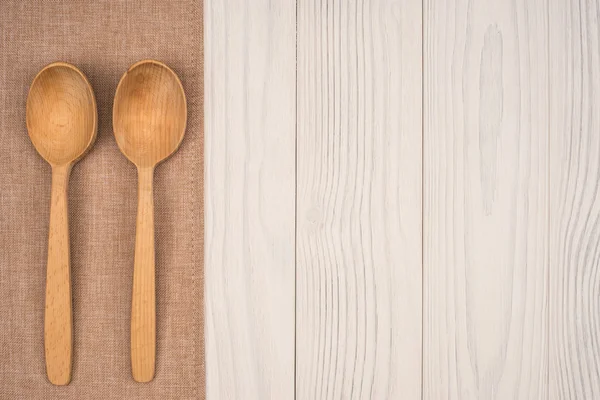 Napkin with a wooden spoon on wooden background Stock Picture