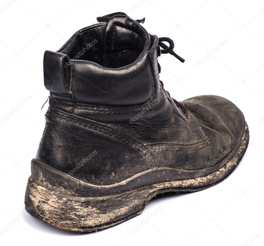 Old dirty boots on a white background