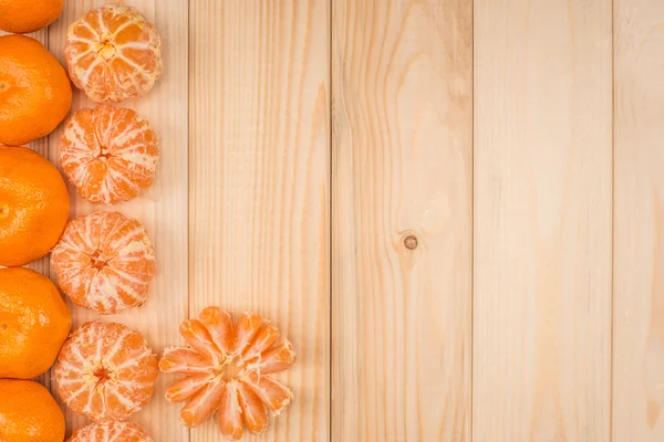 Tangerines on a wooden table — Stock Photo, Image