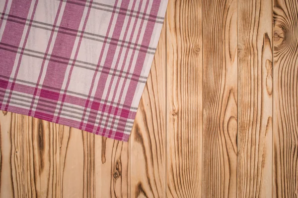 Wooden table covered with tablecloth. View from top. Empty table — Stock Photo, Image