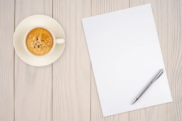 Blank paper with pen and coffee cup on wood table — Stock Photo, Image