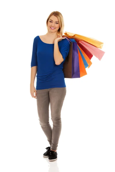 Vrouw met veel boodschappentassen. — Stockfoto
