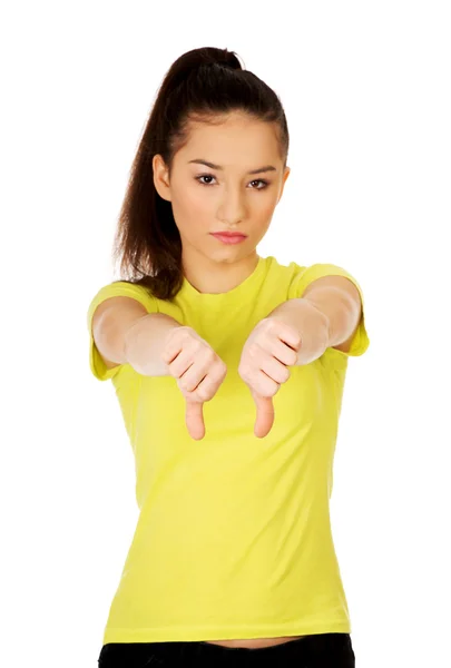 Unhappy woman with thumbs down. — Stock Photo, Image