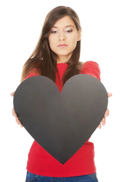 Young woman with heart made from paper. — Stock Photo, Image