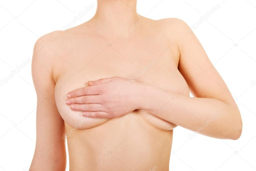 Topless woman covers her breast.