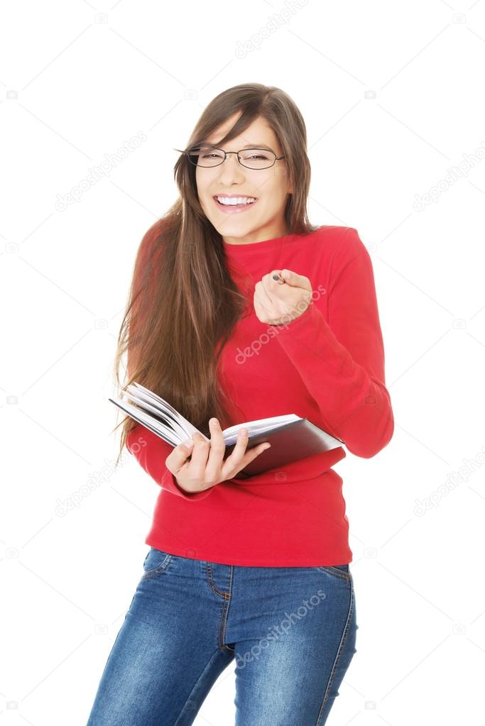 Laughing student woman with her note.