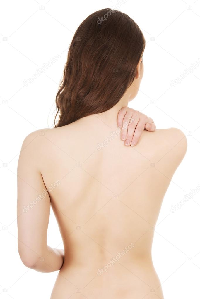 Woman holding her back.