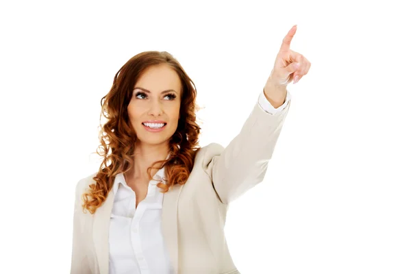 Mujer de negocios señalando hacia arriba . — Foto de Stock