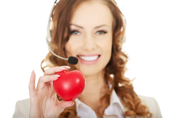 Call center donna con cuore giocattolo . — Foto Stock