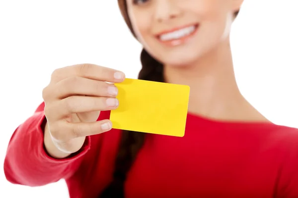 Young woman holding empty business card — Stock Photo, Image