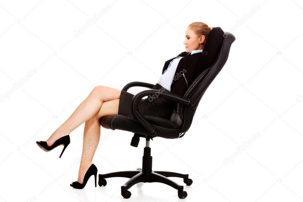 Business woman resting on wheel chair