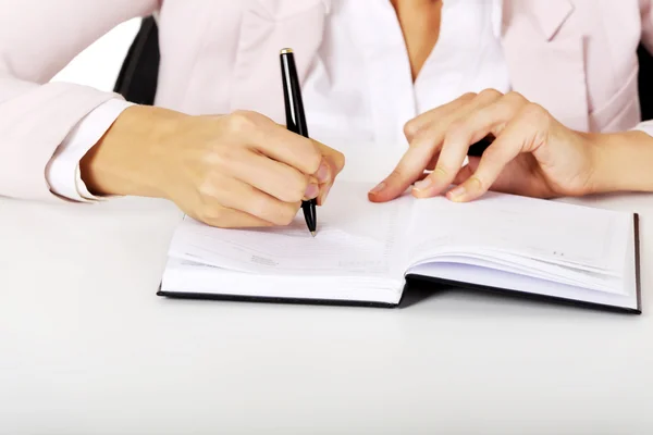 Closeup photo of female hand writing notes — Stock Photo, Image