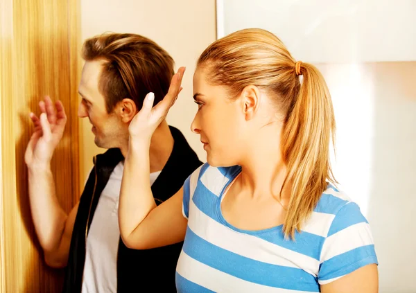 Happy couple going out and waving to friends — Stock Photo, Image