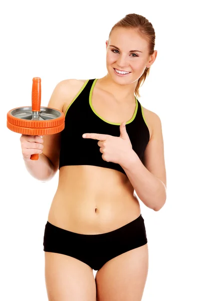 Young and sporty woman holding sport wheel — Stock Photo, Image