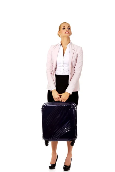 Business woman raising her suitcase — Stock Photo, Image