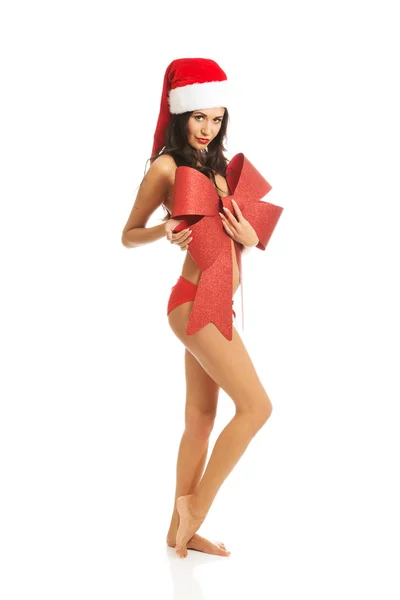 Santa nő állt, és a testét borító szalag, néz ki, mint egy ajándék — Stock Fotó