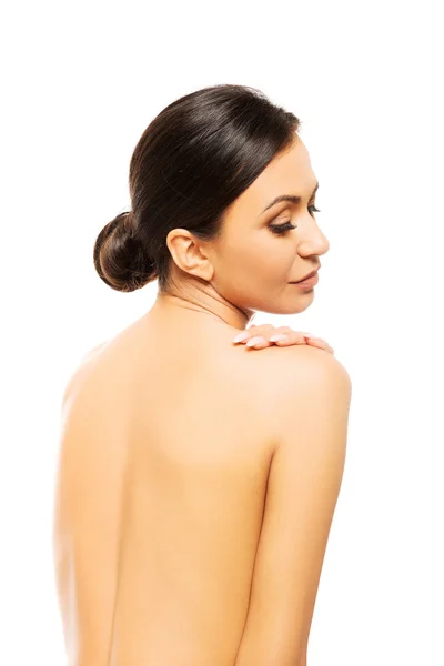 Spa woman touching her shoulder — Stock Photo, Image