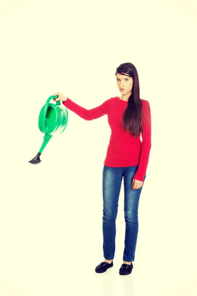 Woman holding a watering can. — Stock Photo, Image