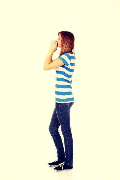 Teenage ill woman using a tissue — Stock Photo, Image