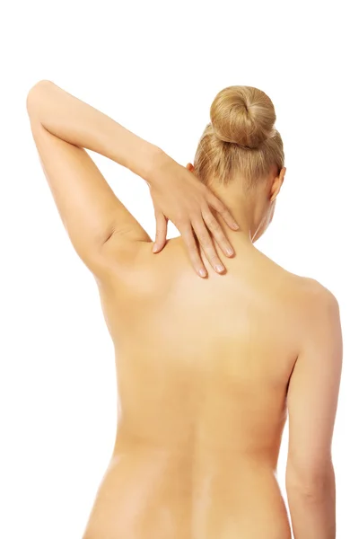 Naked woman with neckache touching her neck — Stock Photo, Image