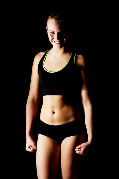 Young athletic woman in black sports underwear — Stock Photo, Image