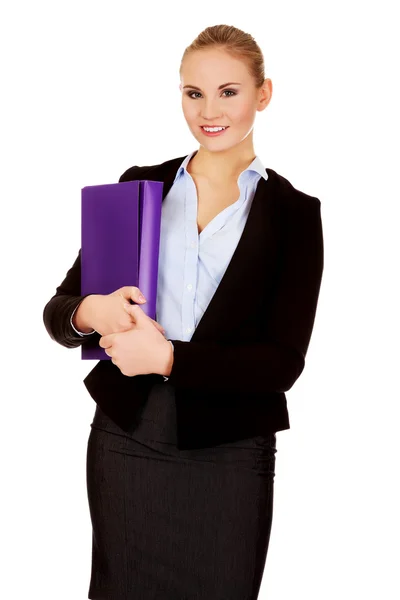 Smiling business woman holding a binder — Stock Photo, Image