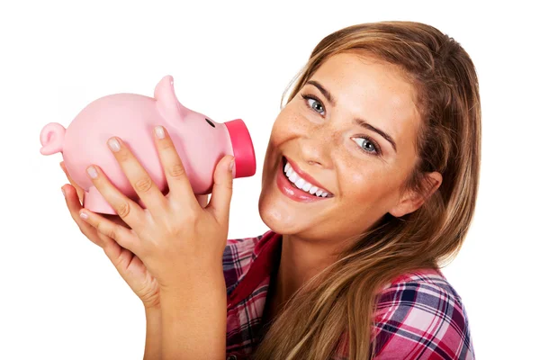 Leende ung kvinna med piggybank — Stockfoto