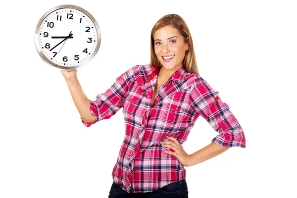 Young happy woman holding a clock — Stock Photo, Image