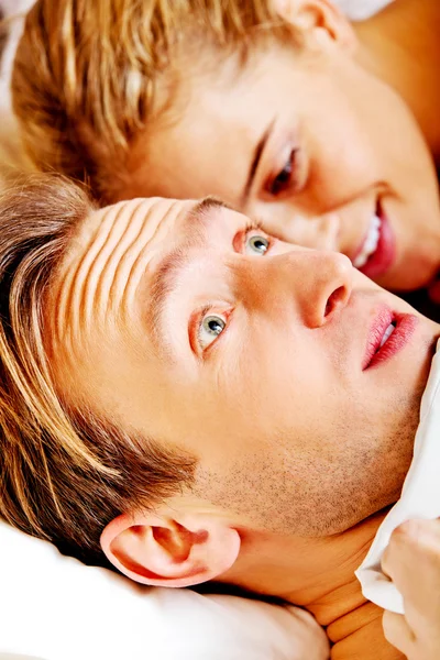 Woman whispering to her husband and he laughting — Stock Photo, Image