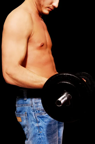 Side view of young muscular man weightlifting — Stock Photo, Image