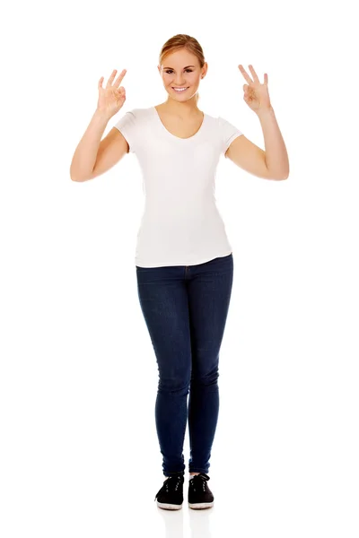 Young woman showing two OK signs — Stock Photo, Image