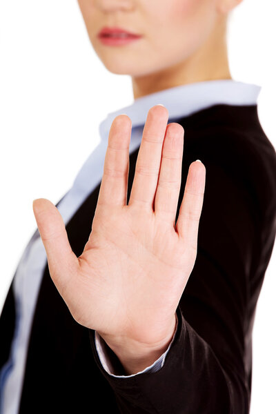Young business woman shows stop gesture