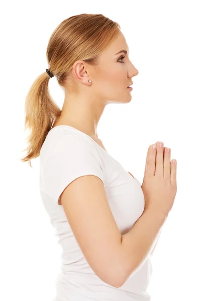 Young woman praying - religion concept Stock Photo