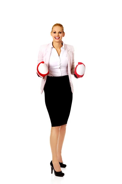 Business woman in red boxing gloves — Stock Photo, Image